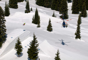 helicopter filming skiier