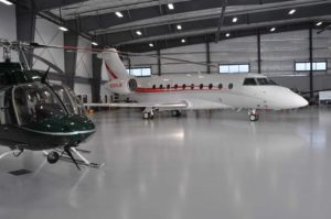 airplane and helicopter in hanger
