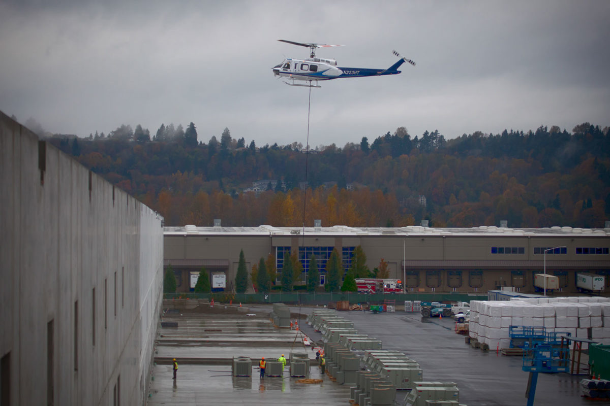 helicopter dropping boxes at a facility